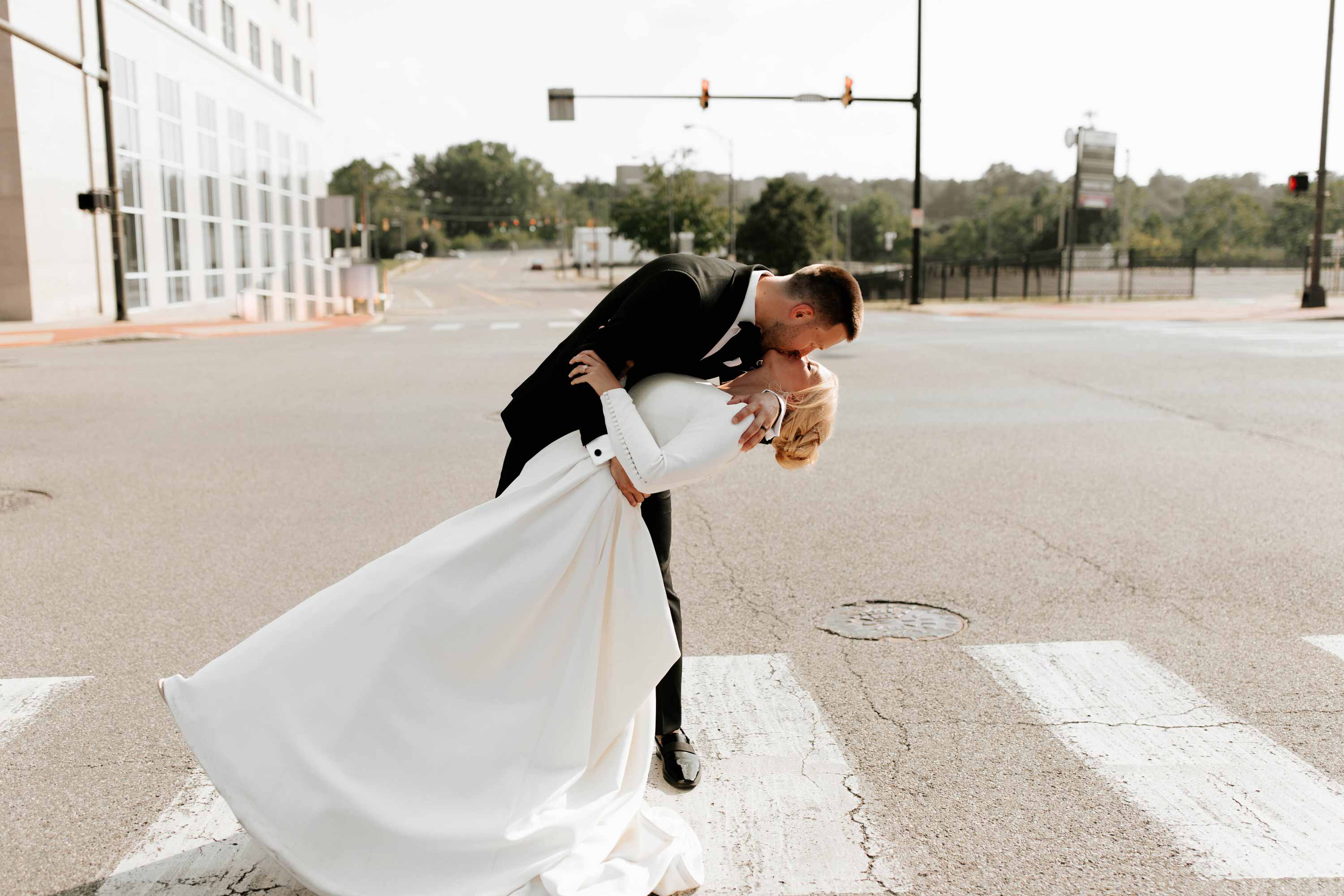 wedding kiss on crosswalk